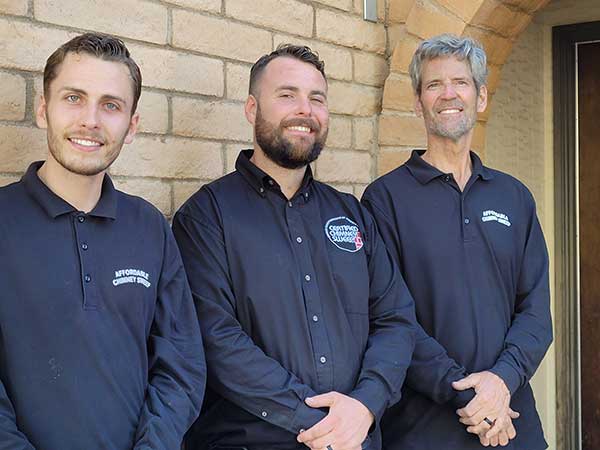 Tucson Chimney Team - 3 techs with blue buttondown shirts.